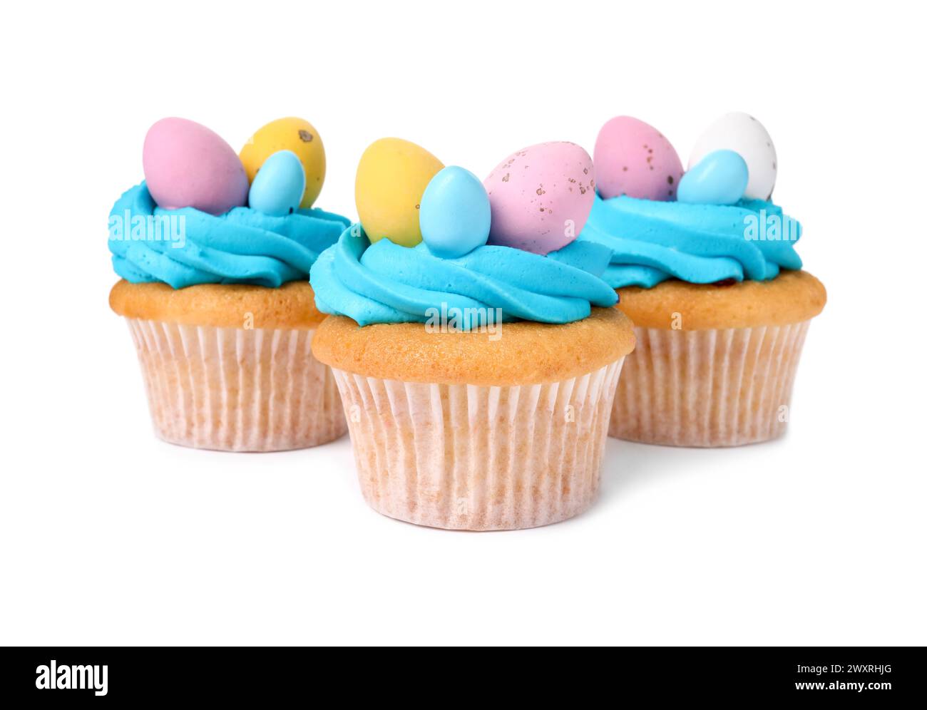 Tasty decorated Easter cupcakes isolated on white Stock Photo