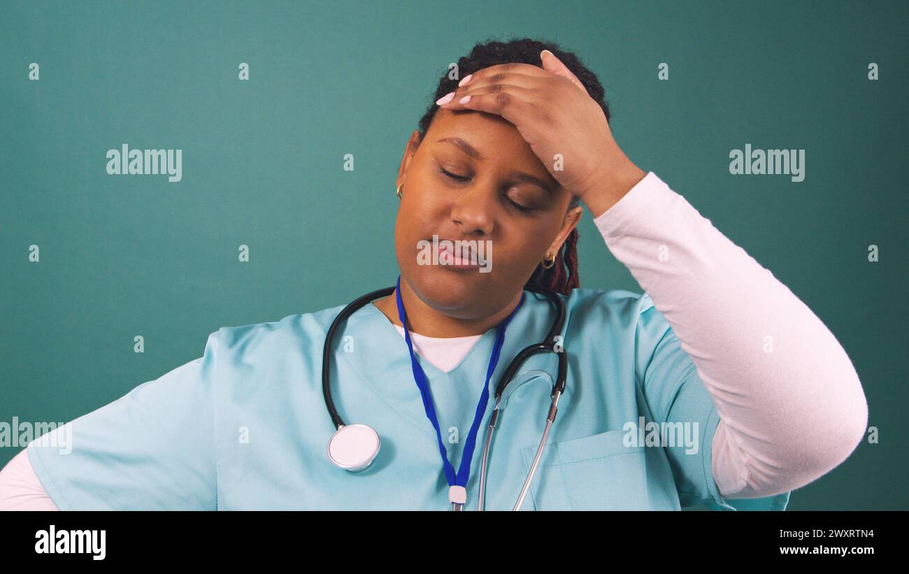 Doctor tired blue scrubs hi-res stock photography and images - Alamy