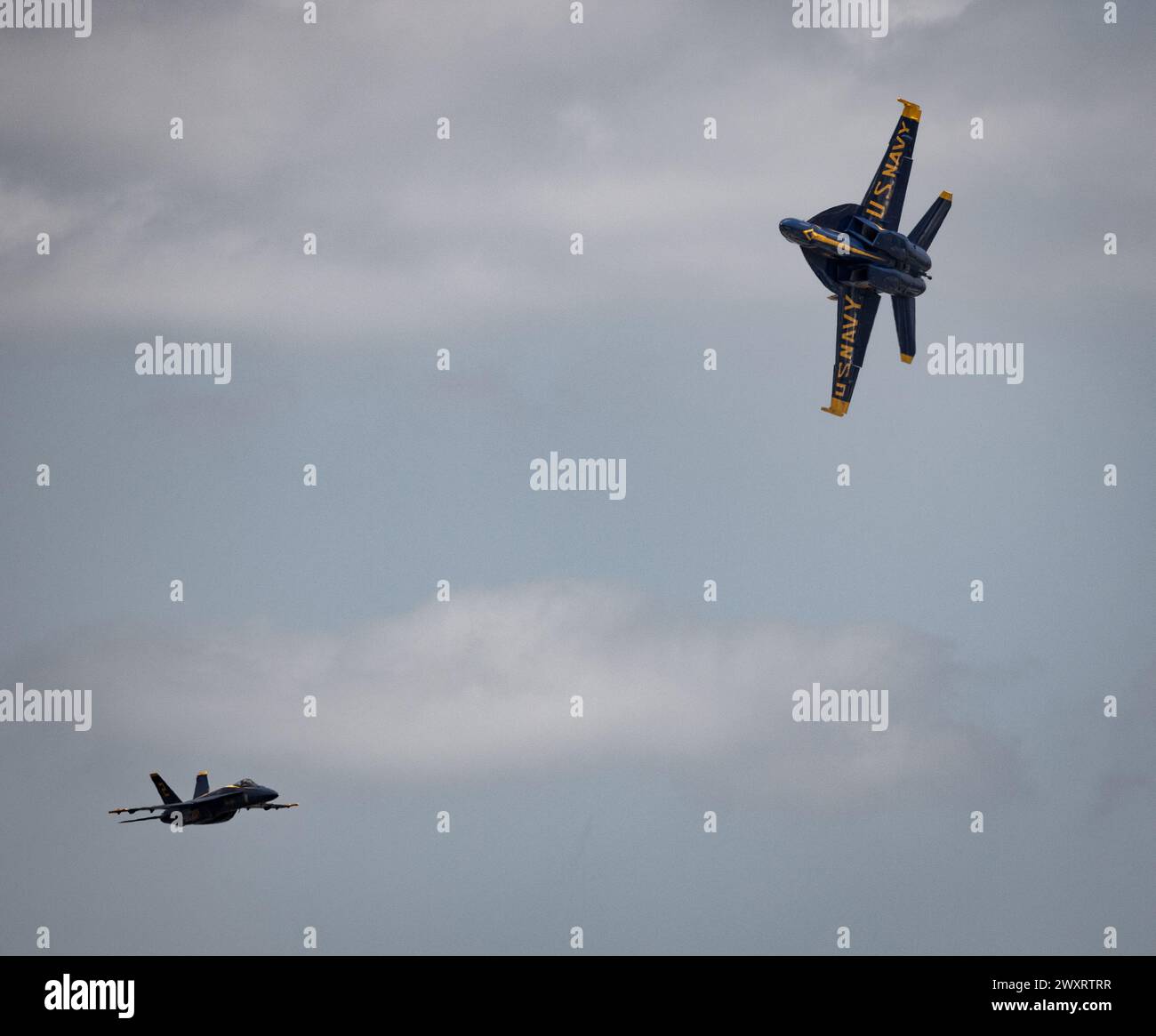 The United States Navy Blue Angel jets perform during a demonstration while flying in formation Stock Photo