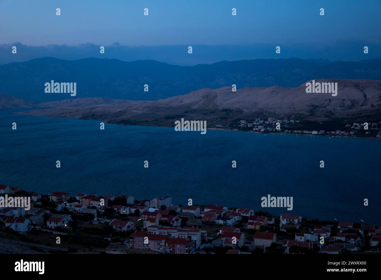 Landscape with a city of Pag in Croatia during summer evening Stock Photo