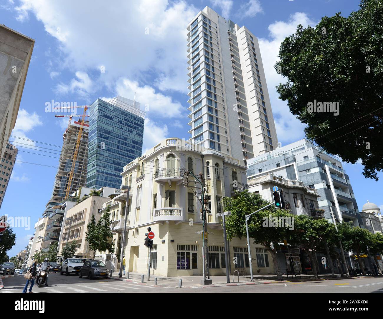 Modern buildings by old renovated buildings on the corner of Allenby St and Rothschild Boulevard in Tel-Aviv, Israel. Stock Photo