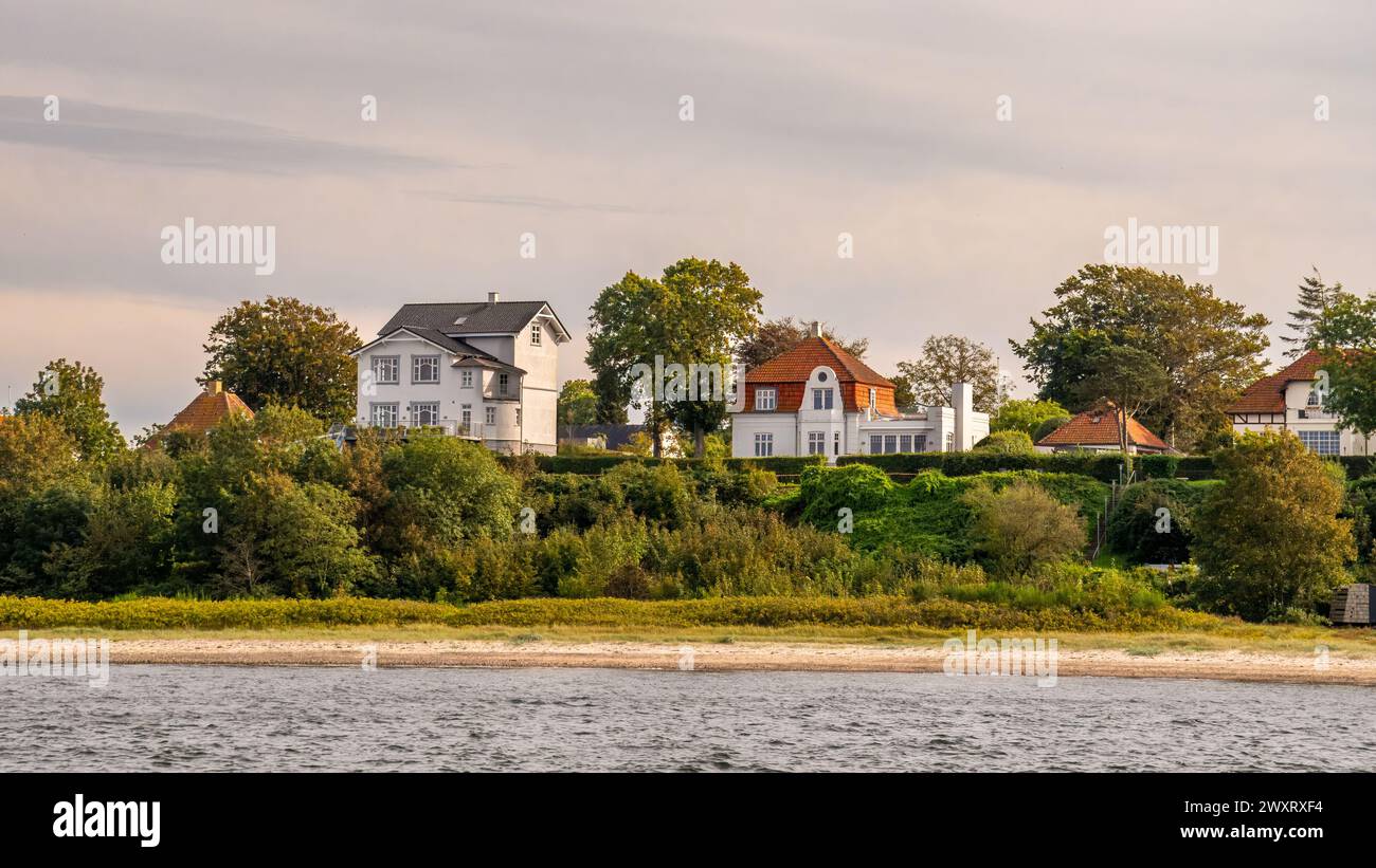 Detached waterfront villas along Little Belt strait in Strib, Middelfart, Funen, Southern Denmark Stock Photo