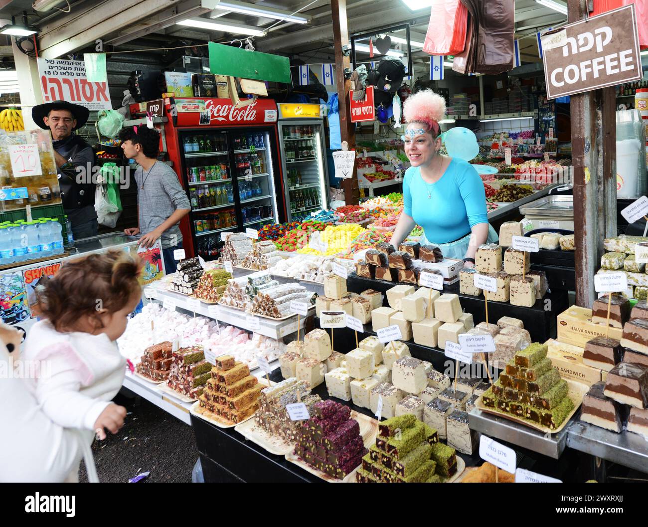 A confectionery vendor selling Halva, Turkish Delight and other sweets at the Carmel market in Tel-Aviv, Israel. Stock Photo