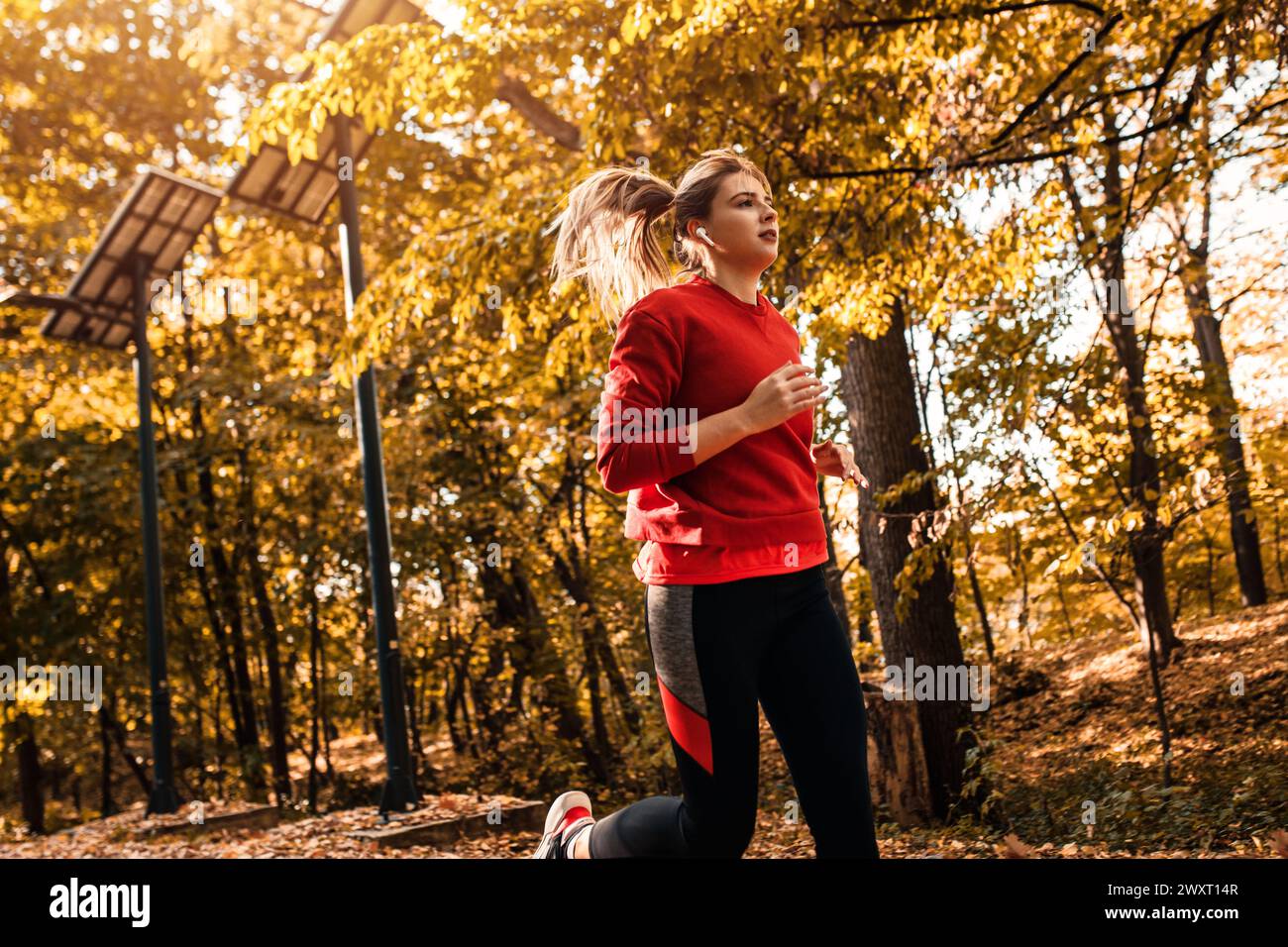 Blonde woman running park hi-res stock photography and images - Alamy