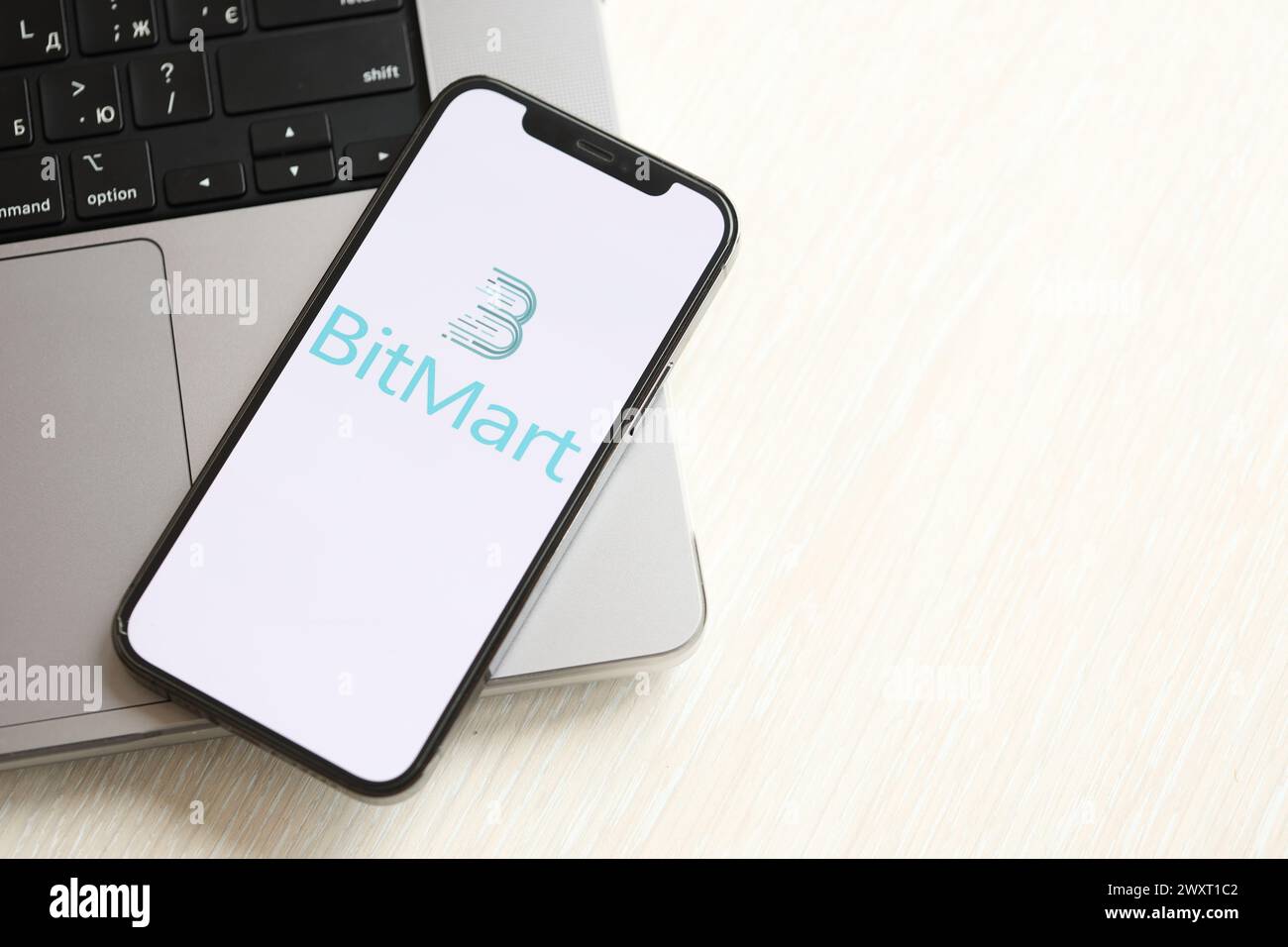 KYIV, UKRAINE - MARCH 15, 2024 Crypto com logo on iPhone display screen  with dollars and bitcoins on MacBook. Cryptocurrency exchange portal Stock  Photo - Alamy