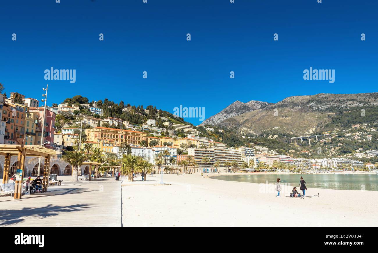 Menton, France - March 02, 2019: day view of Plage des Sablettes in Menton. It is located between the two ports along the Quai Bonaparte and the old t Stock Photo