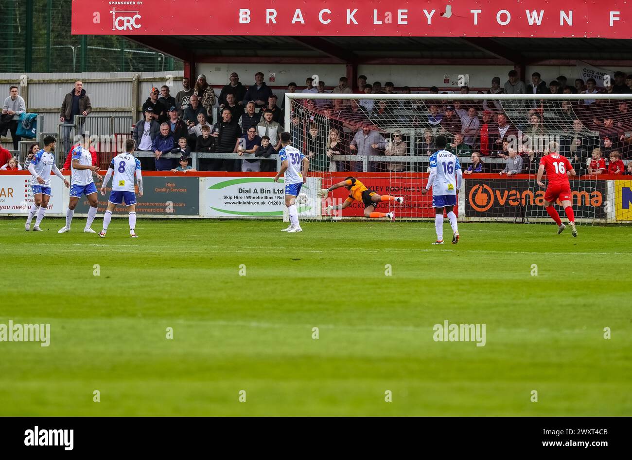 Tamworth goalkeeper Jas Singh makes a save against Brackley Town in the Vanarama National League North on the 1st April 2024. Stock Photo