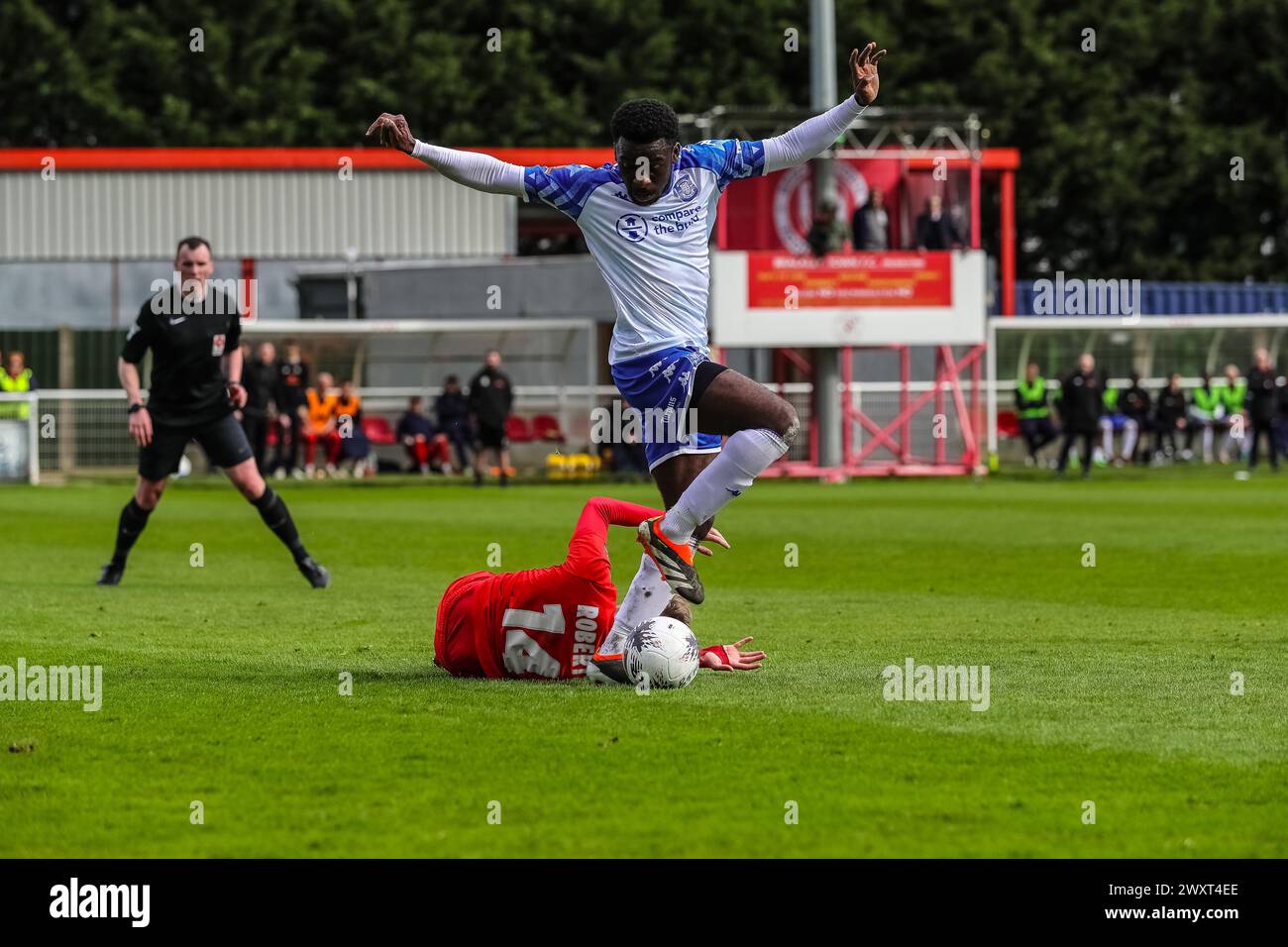 Tamworth's Ben Acquaye avoinds a challenge by Brackley Town's Morgan Roberts during their Vanarama National League North match at St James Park on Mon Stock Photo