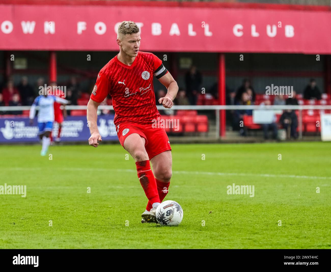 Brackley Town captain Gareth Dean with the ball during their Vanarama National League North match against Tamworth at St James Park on Monday 1st Apri Stock Photo