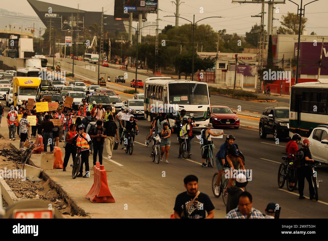 Cyclists and people with disabilities march during a protest. The Union of Cycling Associations of Querétaro, together with representatives of various groups of people with disabilities, pedestrians, and public transport users, held a demonstration on Paseo 5 de Febrero, to demand, through a human cycle path, a walk and a ride, that Consider in the mega project (which has not yet completed its construction and in which more than 6 billion pesos were invested) the conditions for sustainable mobility and that only car users are not prioritized. Stock Photo