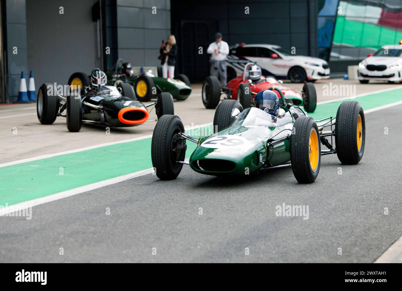 Nick Fennell driving his British Racing Green, 1962, Lotus 25,down the pit lane before the start of the HGPCA Rear-Engined Pre'66 Grand Prix Race Stock Photo