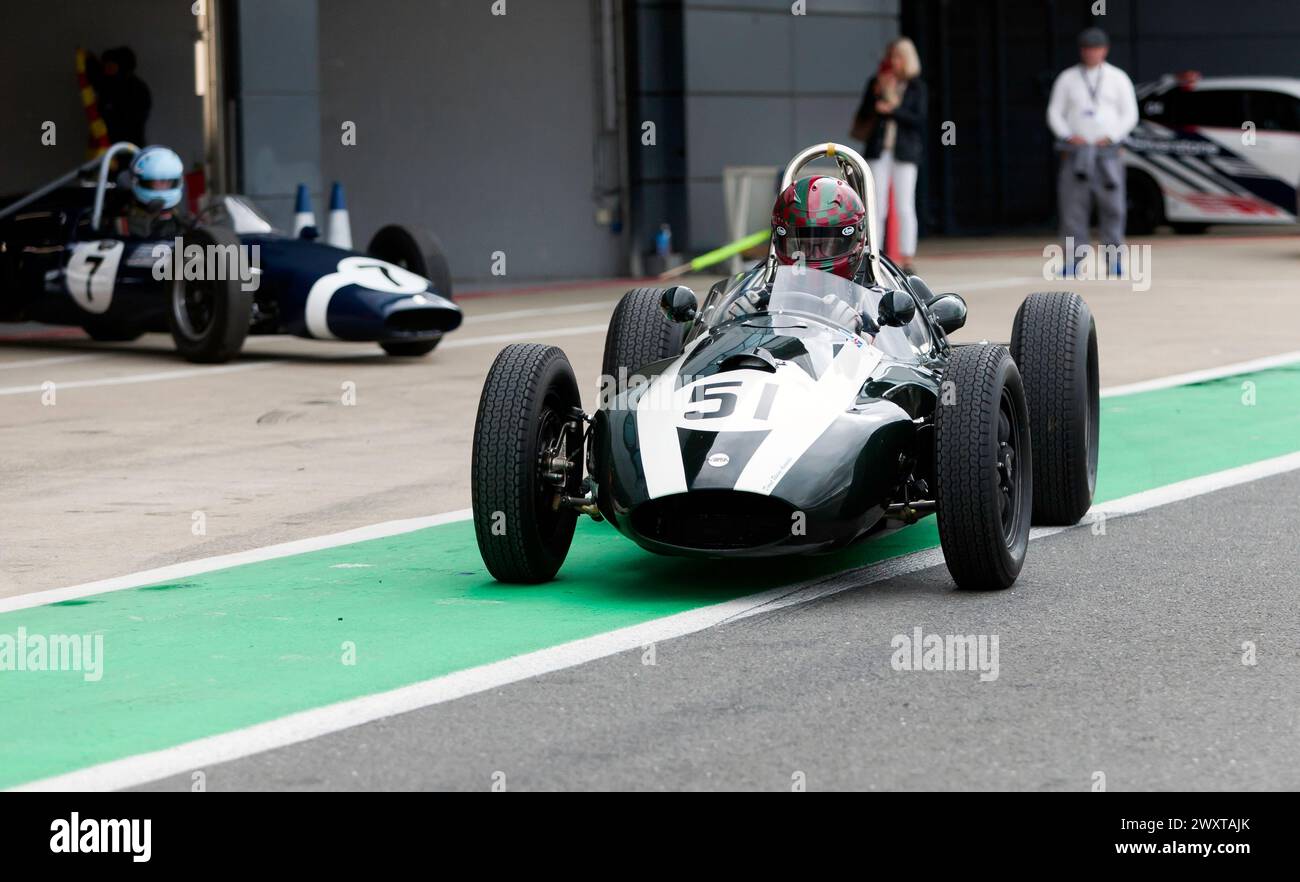 Tom Waterfield driving his British Racing Green, 1957, Cooper T43,down the pit lane before the start of the HGPCA Rear-Engined Pre'66 Grand Prix Race Stock Photo