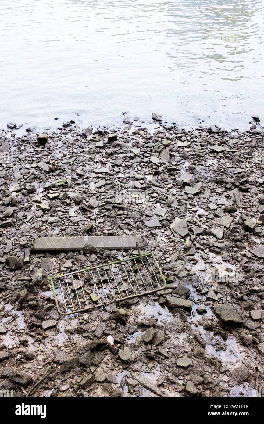 Ugly Rivers Ugly, polluting mad made debris by the shoreline of the River Thames in ...