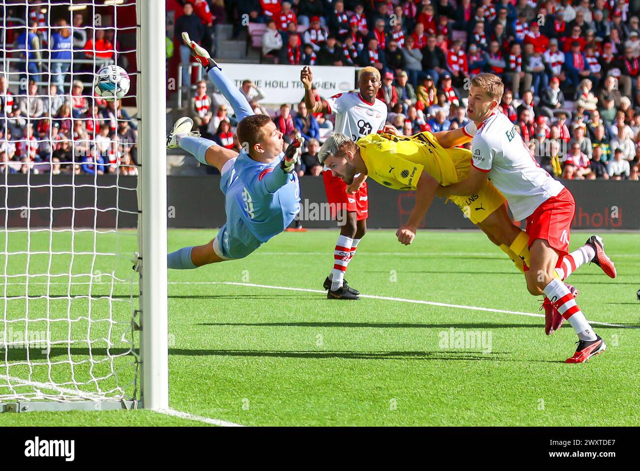 Fredrikstad, Norway, 1st April 2024.  Bodø/Glimt's Fredrik Bjørkan scores his side's first with a diving header in the Eliteserien match between Fredrikstad and Bodø/Glimt at Fredrikstad stadium.  Credit: Frode Arnesen/Frofoto Stock Photo