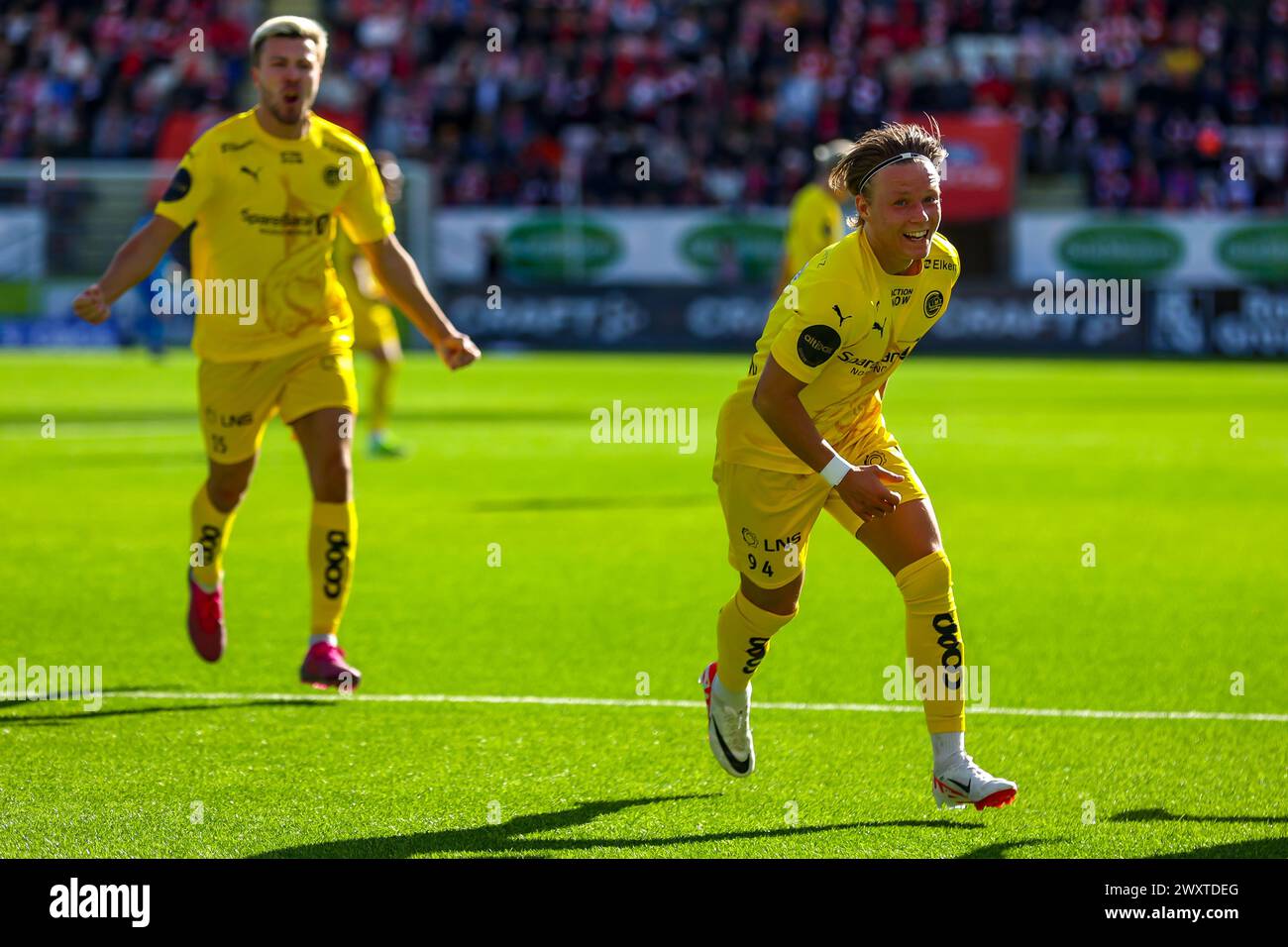 Fredrikstad, Norway, 1st April 2024. Bodø/Glimt's August Mikkelsen celebrates scoring on his debut for Bodø/Glimt in the Eliteserien match between Fredrikstad and Bodø/Glimt at Fredrikstad stadium.   Credit: Frode Arnesen/Alamy Live News Stock Photo