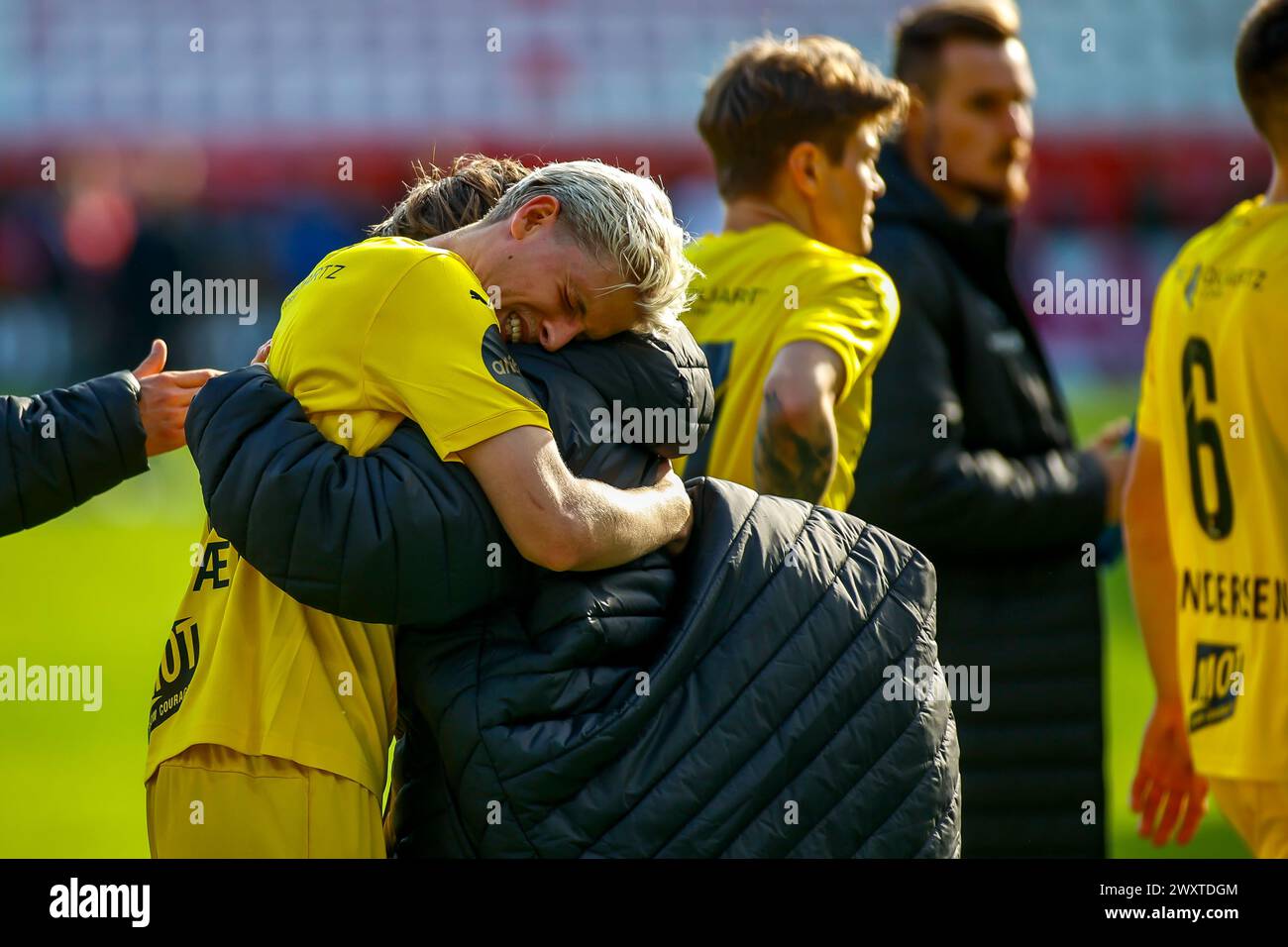 Fredrikstad, Norway, 1st April 2024.  Bodø/Glimt's Albert Grønbæk hugs debutant Bodø/Glimt's August Mikkelsen after the Eliteserien match between Fredrikstad and Bodø/Glimt at Fredrikstad stadium.  Credit: Frode Arnesen/Alamy Live News Stock Photo