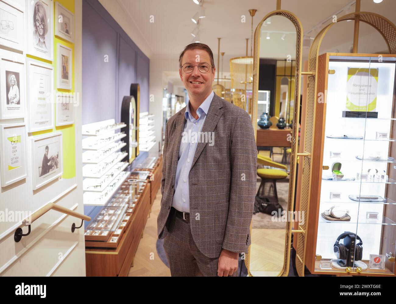 Hamburg, Germany. 02nd Apr, 2024. Carsten Bode, co-owner and Managing Director of Optiker Bode, smiles during a photo session at a branch of Optiker Bode on Gänsemarkt. The optician chains Optiker Bode from Hamburg and Rottler from Sauerland take over the insolvent Hamburg-based Edel-Optics GmbH along with its 40 employees. Credit: Christian Charisius/dpa/Alamy Live News Stock Photo