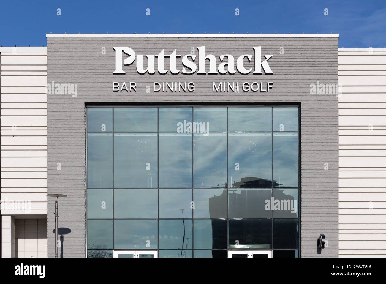 Puttshack is an an indoor miniature golf company that have gun games and food and drink. Stock Photo