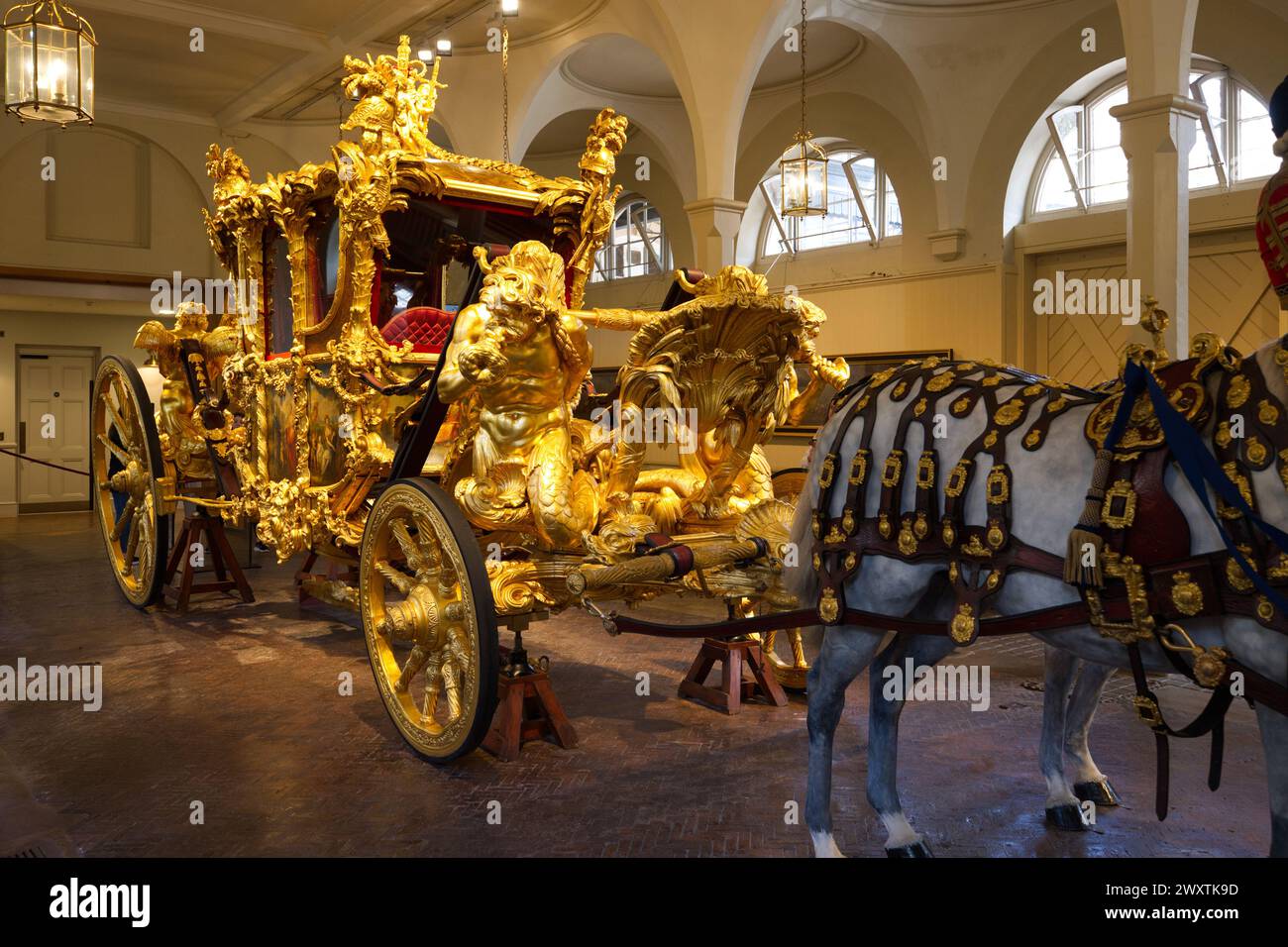 The Gold State Coach used by the British Royal Family stored in The Royal Mews Stock Photo