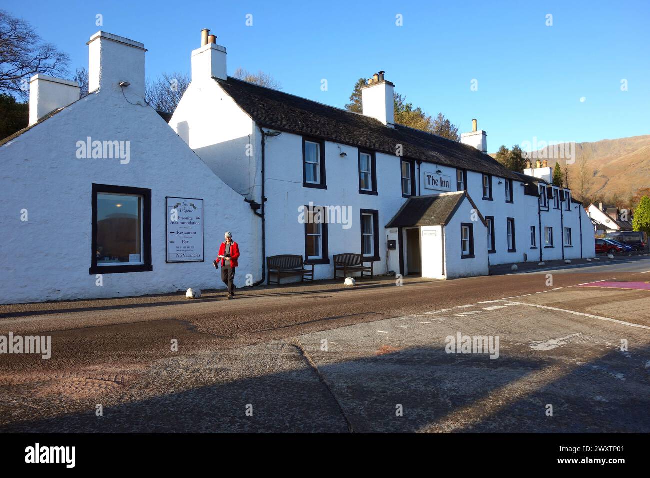 Man (Hiker) Walking from The Inn at Corran in Ardgour, Scottish North West Highlands, Scotland, UK. Stock Photo