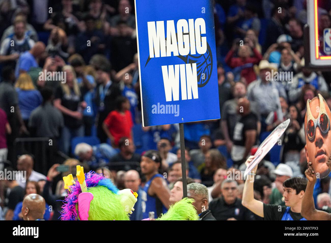 Orlando, Florida, USA, April 1, 2024, Orlando Magic mascot Stuff the Magic Dragon holds a Magic Win sign after the game at the Kia Center. (Photo Credit: Marty Jean-Louis/Alamy Live News Stock Photo