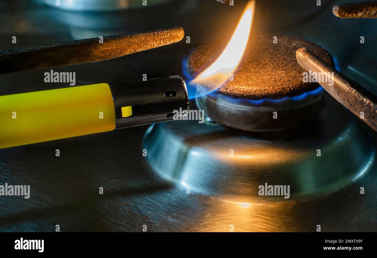 Closeup of Ignited flame on a spark gas igniter . Concept of gas shortage and crisis Stock