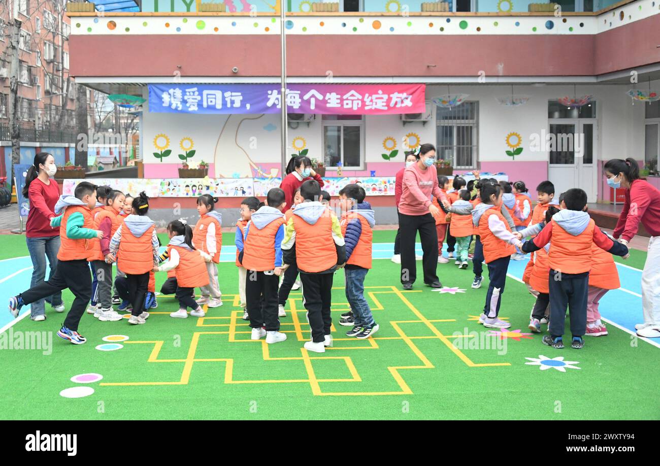 (240402) BEIJING, April 2, 2024 (Xinhua) Teachers play games with