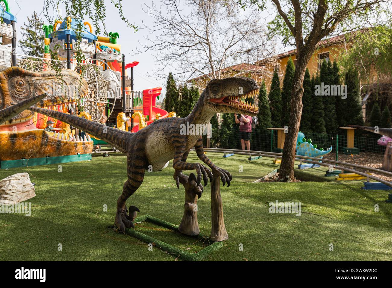 Velociraptor in an amusement park in austria Stock Photo - Alamy