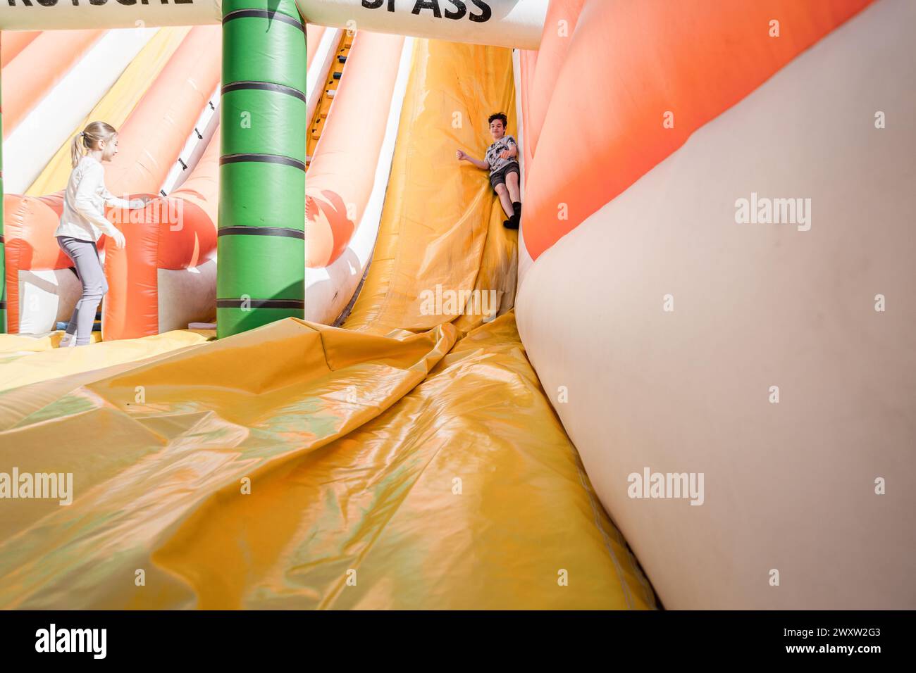 Bad Gleichenberg, Austria - March 30th 2024 - A boy on an inflatable ...