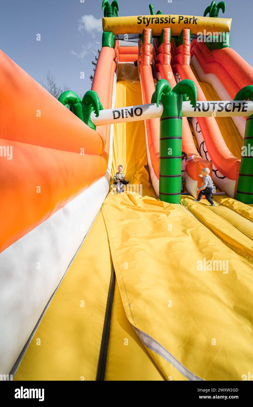 Bad Gleichenberg, Austria - March 30th 2024 - A boy on an inflatable ...