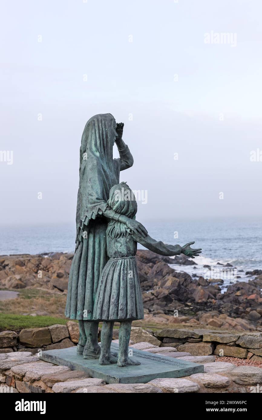 Memorial statue of a fisher woman and her daughter looking out to sea, created in memory of those lost at sea, Cairnbulg, Aberdeenshire, Scotland. Stock Photo