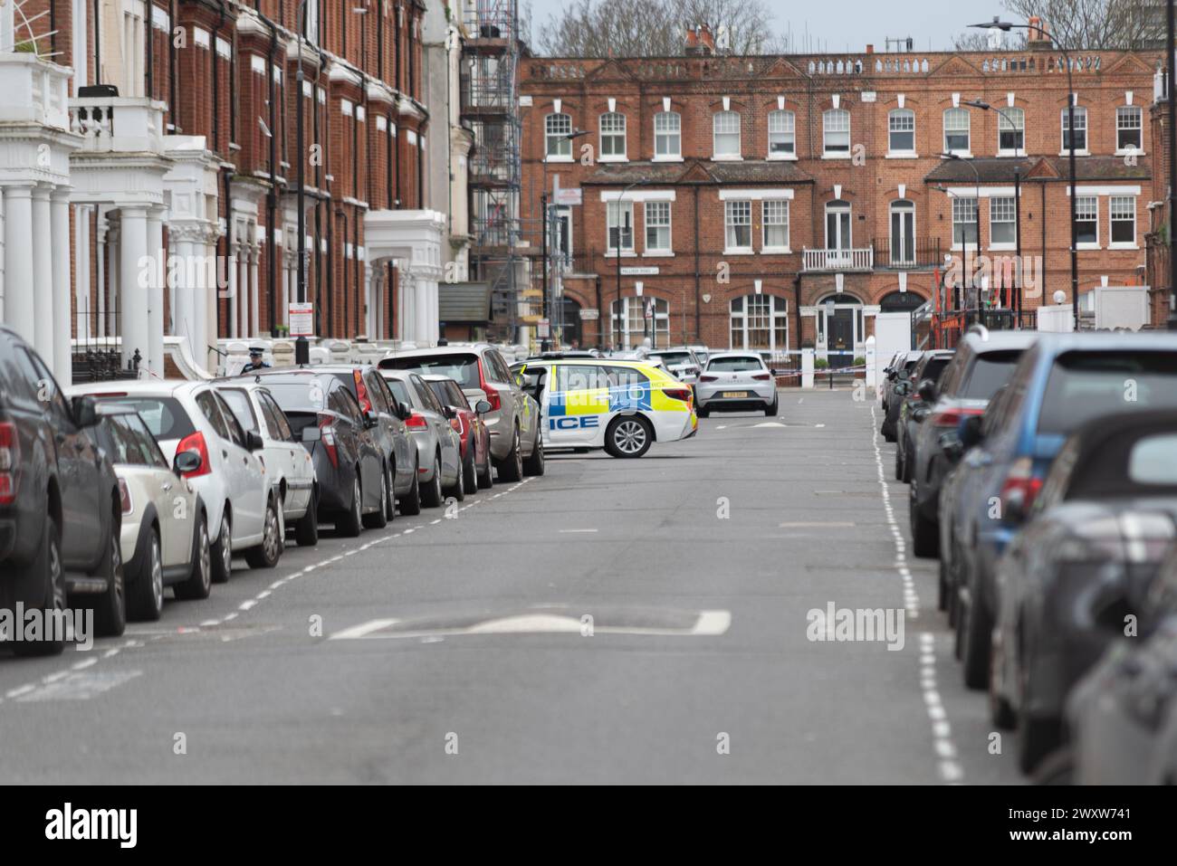 Comeragh Road, West Kensington, London, UK. 2nd Apr, 2024. Police and forensic teams are at the scene of a fatal shooting in Comeragh Road. A 21-year-old man was shot dead on Monday night Stock Photo
