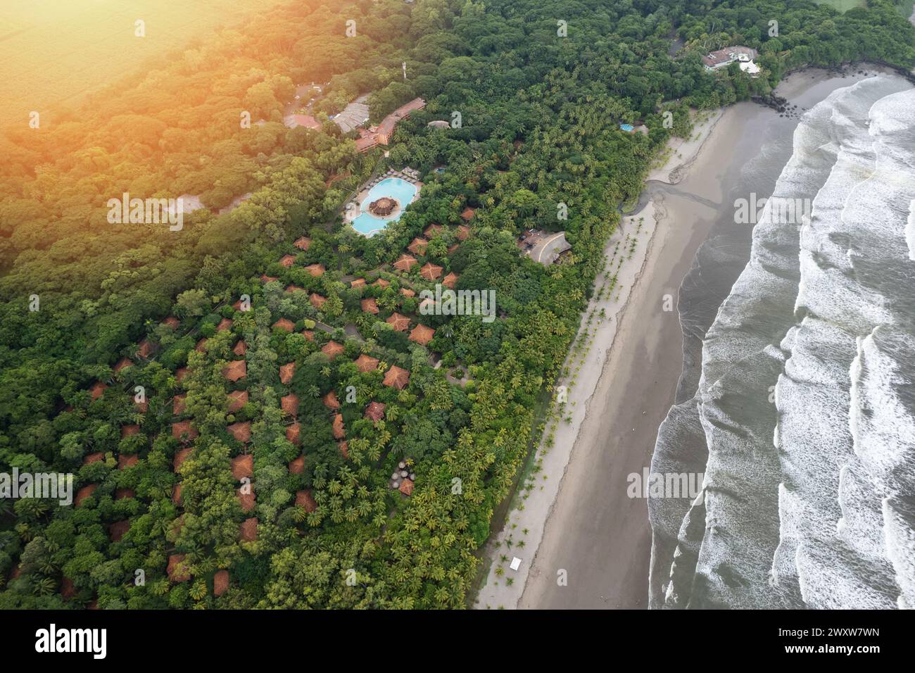 Beach coastline near tropical resort hotel aerial drone top view Stock Photo