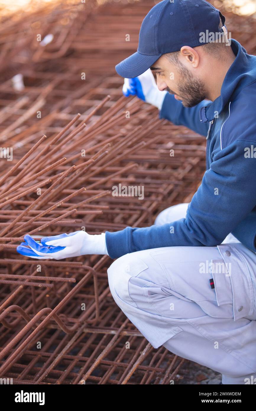 construction worker laying blockwork at site Stock Photo