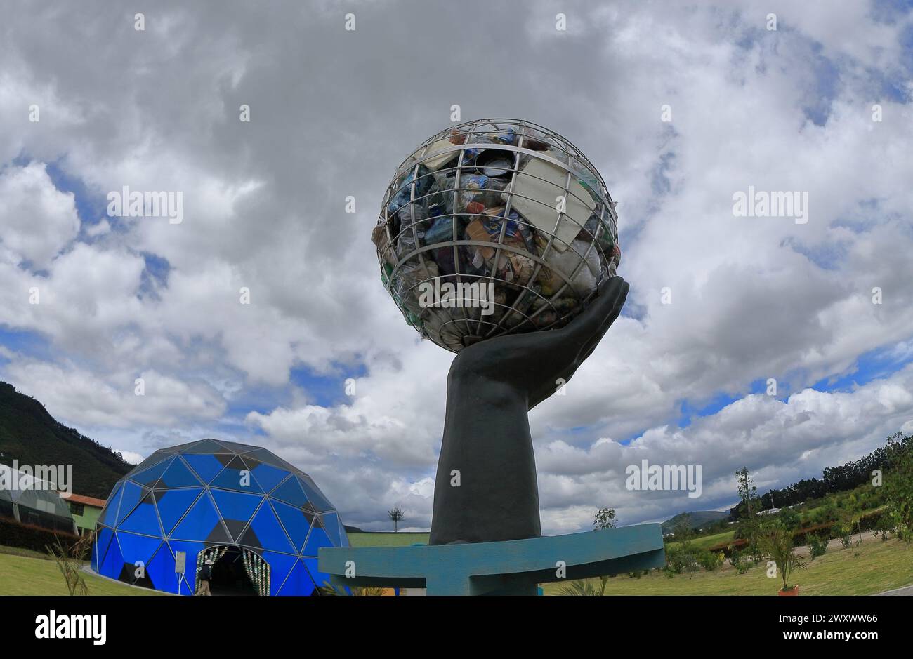 Bogota, Colombia. 24-01-2024. A hand holds a balloon that represents the earth full of pollutions materials in the ecological park Jaime Duque. Photo; Stock Photo