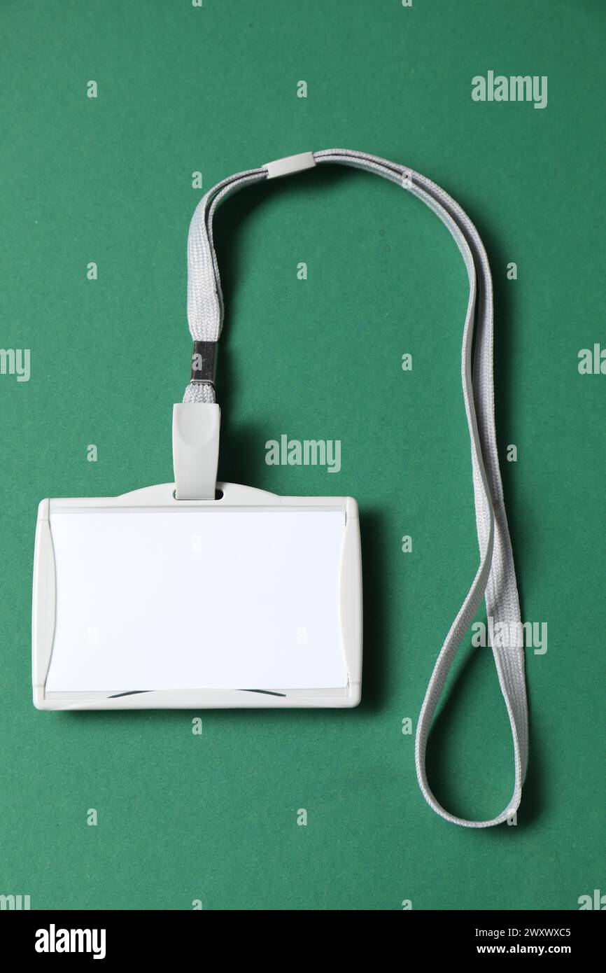 Blank badge with string on green background, top view Stock Photo - Alamy