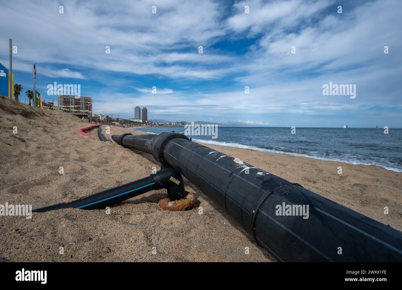 Barcelona, Catalonia, Spain. 2nd Apr, 2024. Lines of tubes for the supply of water and electricity are seen unearthed on the beach of Sant SebastiÃn due to the effect of sea storms. The successive and intense sea storms that the beaches of Barcelona have been suffering, especially this last week, make constant public investment necessary in repairing damage to breakwaters and surveillance, as well as the replacement of large quantities of sand to replenish the beaches of the city. (Credit Image: © Paco Freire/SOPA Images via ZUMA Press Wire) EDITORIAL USAGE ONLY! Not for Commercial USAGE! Stock Photo