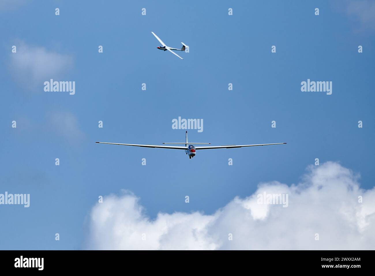 Glider in the sky begin landing Stock Photo - Alamy