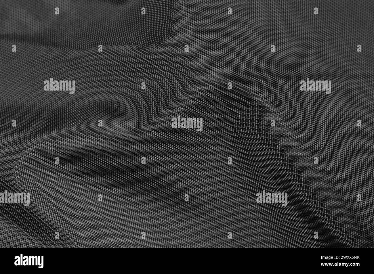 Black crumpled natural nylon fabric texture pattern detail large