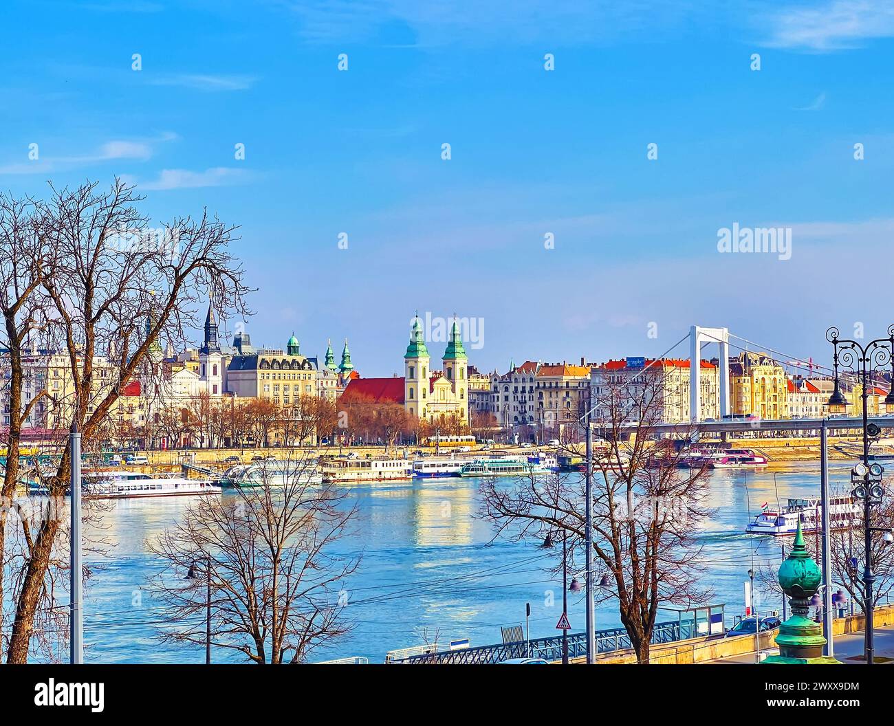 Danube riverside view of Pest with Inner City Parish Church, Assumption of the Blessed Virgin Mary Cathedral and Elisabeth Bridge, Budapest, Hungary Stock Photo