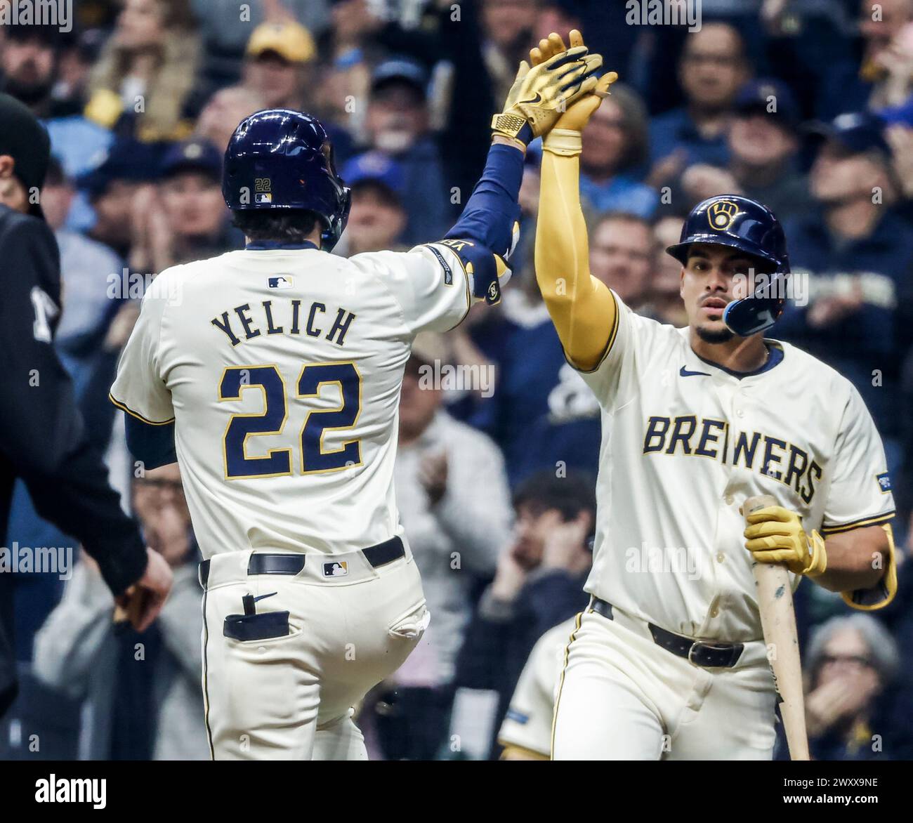 Milwaukee Brewers left fielder Christian Yelich (L) celebrates with
