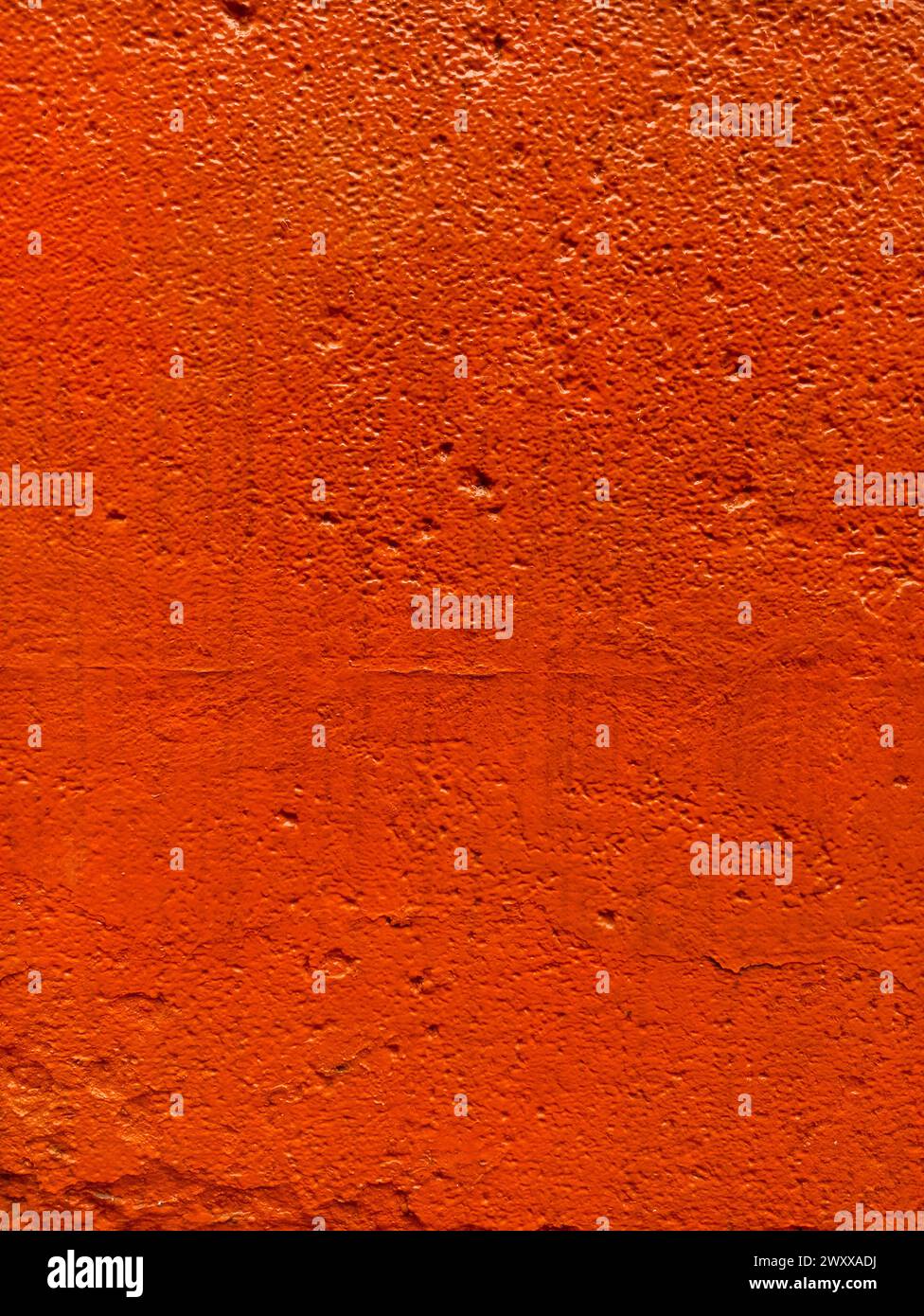 Blurred red stucco wall background  painted cement wall texture Stock Photo