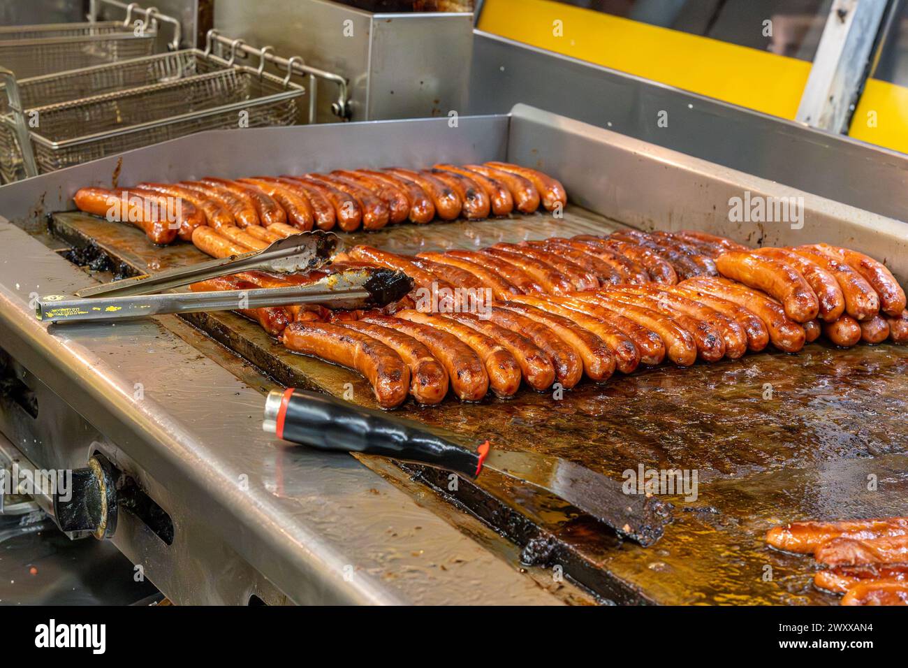 Washington DC - US - Mar 22, 2024 Interior closeup of grilled half-smokes at the iconic Ben's Chili Bowl, a landmark restaurant on U Street in Washing Stock Photo