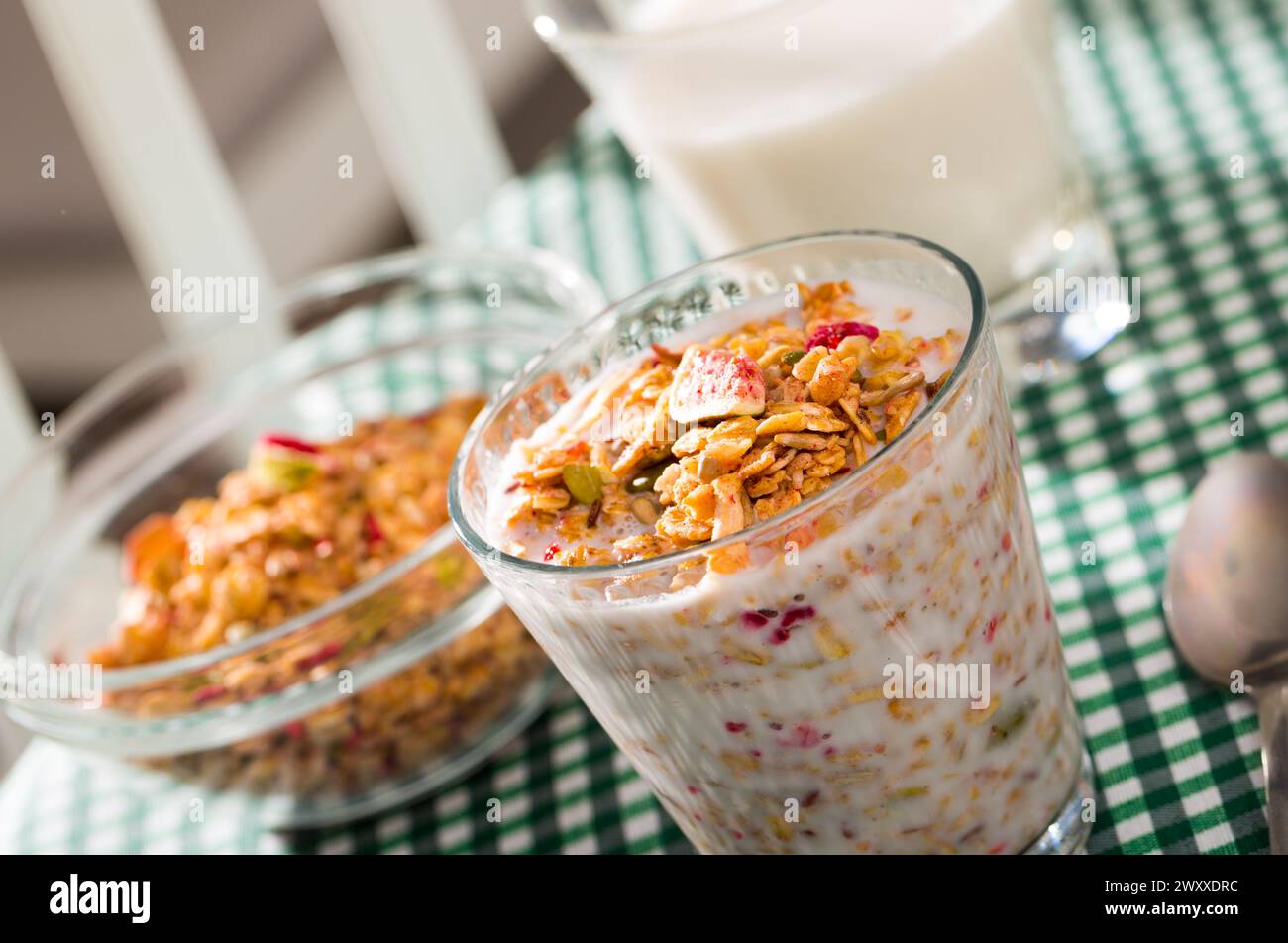 Glass of milk with muesli Stock Photo Alamy