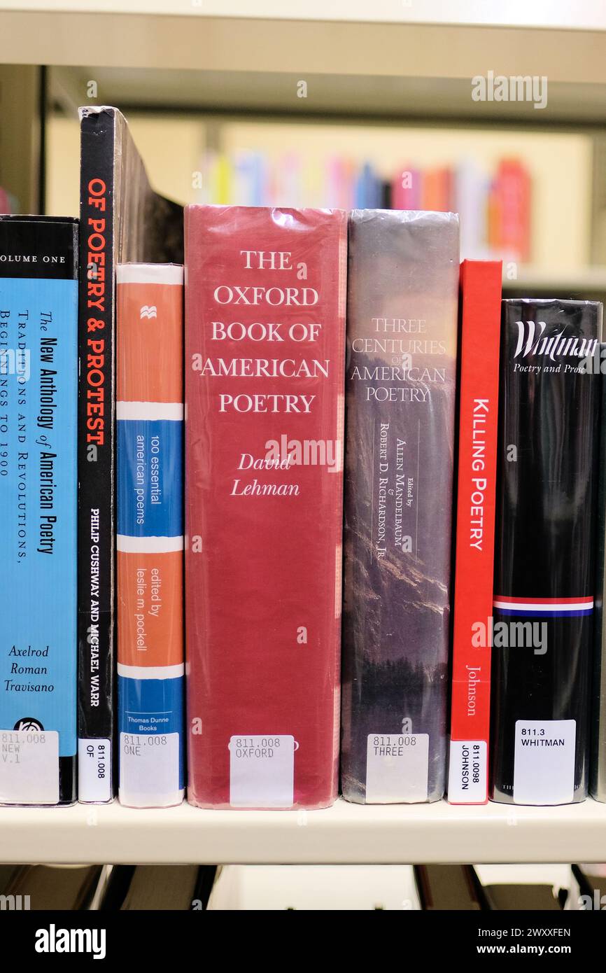 Library shelf with poetry collections, anthologies: American poetry, Whitman, English language, Oxford Book of American Poetry, protest, literature. Stock Photo