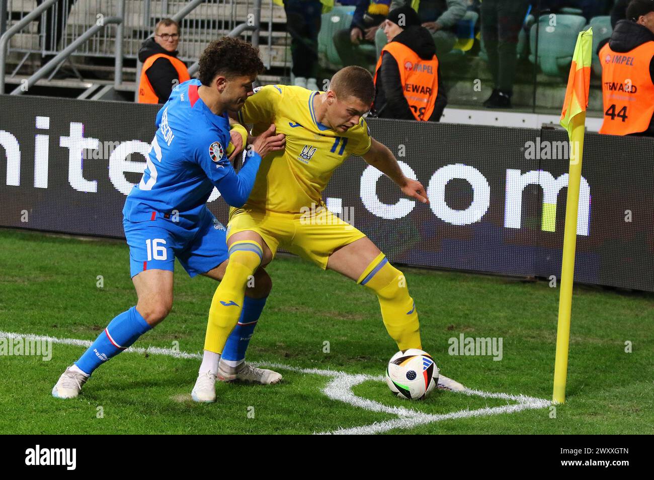 Wroclaw, Poland - March 26, 2024: Artem Dovbyk of Ukraine (R) fights for a ball with Mikael Anderson of Iceland during their UEFA EURO 2024 Play-off game at Tarczynski Arena. Ukraine won 2-1 Stock Photo