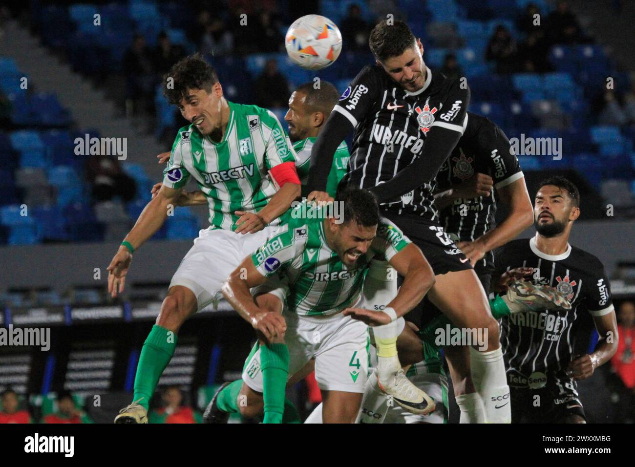 Montevideo, Uruguay. 02nd Apr, 2024. Jose Varela and Guillermo Cotugno of Racing battles for possession ball with Pedro Raul of Corinthians, during the match between Racing and Corinthians for the first round of group F of Copa Sulamericana 2024, at Centenario Stadium, in Montevideo, Uruguay on April 02. Photo: Pool Pelaez Burga/DiaEsportivo/Alamy Live News Credit: DiaEsportivo/Alamy Live News Stock Photo