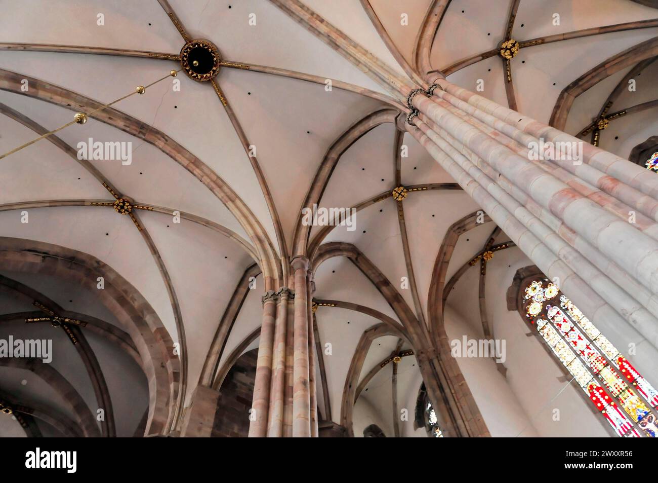 The Lutheran Church of St Thomas, Eglise Saint Thomas de Strasbourg, Alsace, Vaulted ceiling and columns inside a church with Gothic architecture Stock Photo