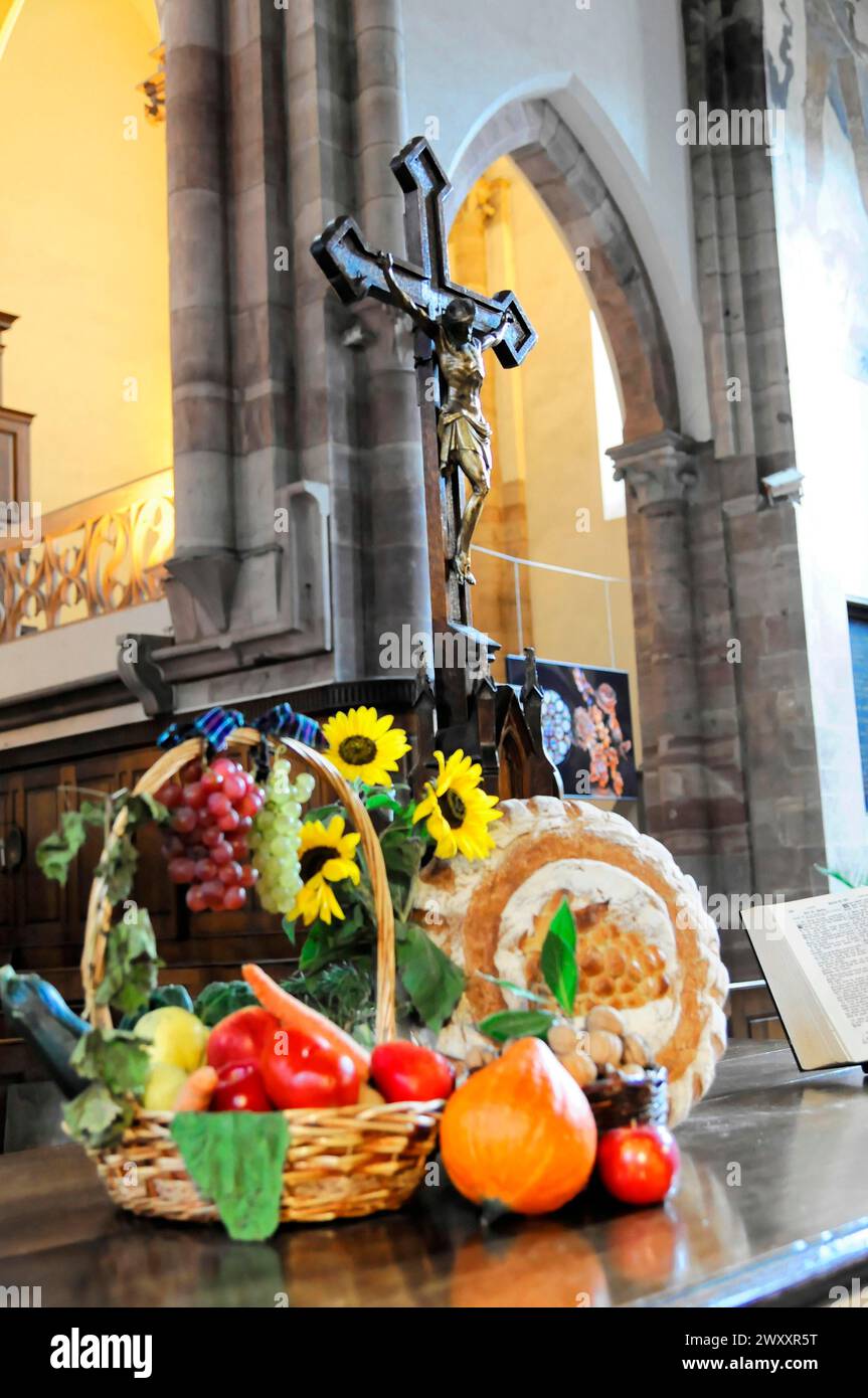 Interior view, Saint-Thomas church, Strasbourg, church altar with a crucifix and a basket of fruit as an offering next to it, Strasbourg, Alsace Stock Photo