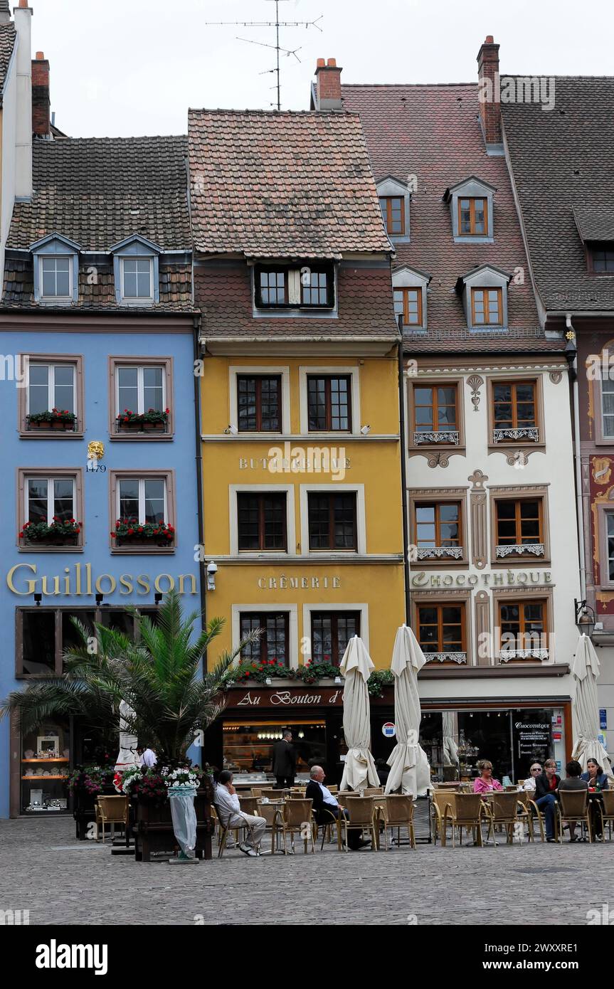 Row of houses, city centre, view of a street with colourful houses and cafes, animated by passers-by, Mulhouse, Alsace, Alsace, France Stock Photo